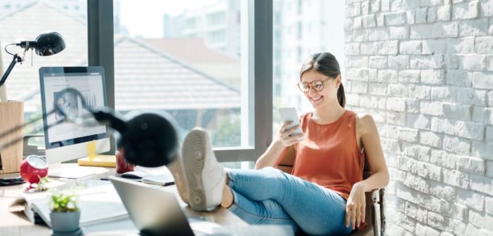 An image of a person using a crm database to make a phone call.